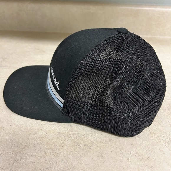 Travis Mathew’s men’s Black Trucker Hat with Blue Stripe - Picture 2 of 4
